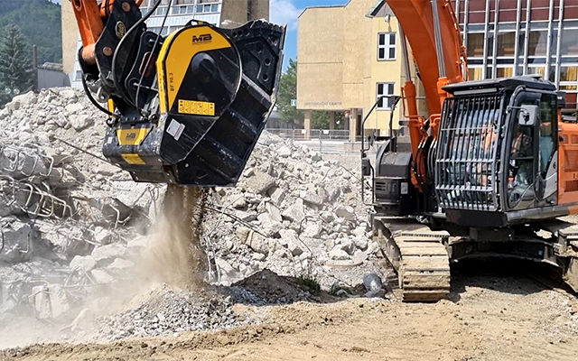 A crusher bucket BF90.3 is crushing concrete that will be used a sub-base later 