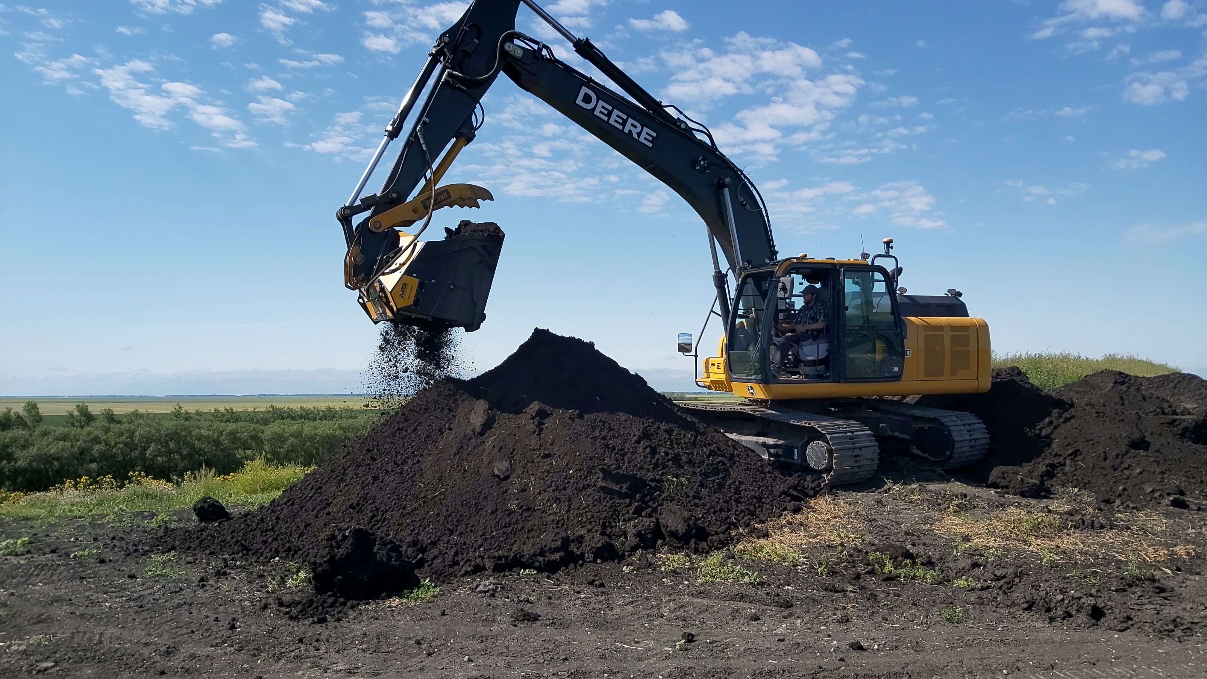 Oak Bluff Colony Farms and MB Crusher working cooperatively