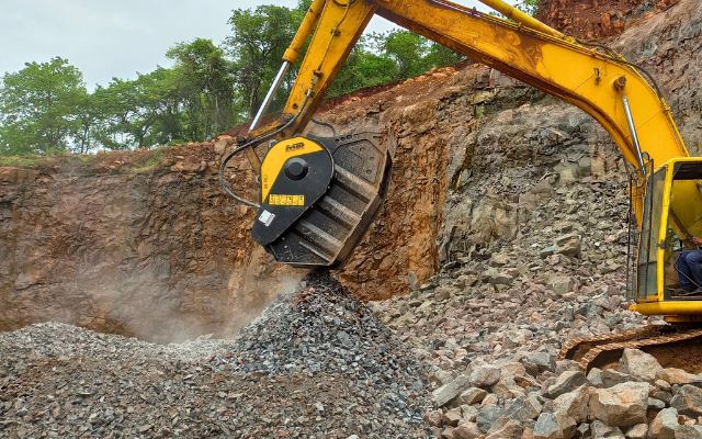 •	Basalt rocks before and after processing with MB Crusher's bucket crusher for cost-saving road base filling.