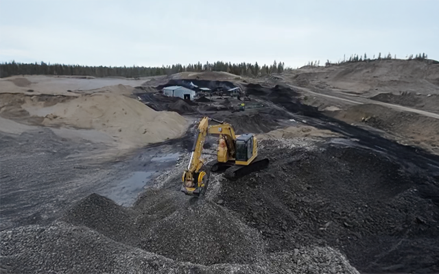 MB Crusher bucket crushing riverbed material into top quality aggregate in Kelowna, British Columbia.