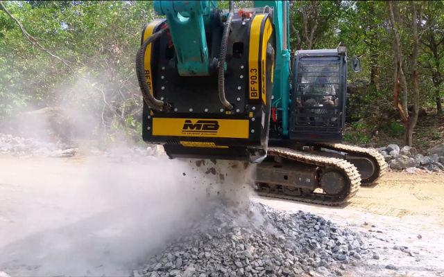 Crusher bucket at work in a road project in India