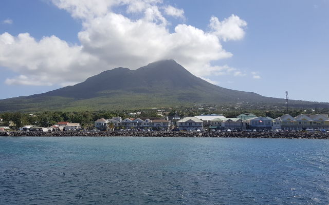 A crusher bucket and a screening bucket at work on a Caribbean island 