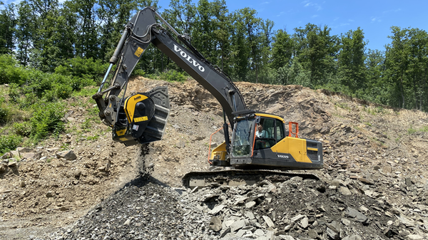 Crusher bucket that reduces granite